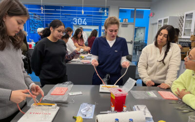 Rosalind Franklin Surgeon and Med Students Conduct Suture Clinic to Inspire Medical Careers for CRSM Students